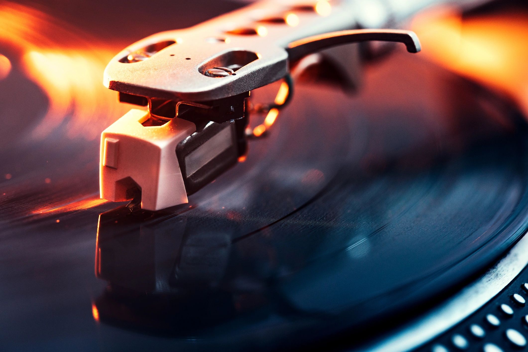 Close-up of a turntable needle on a spinning vinyl record